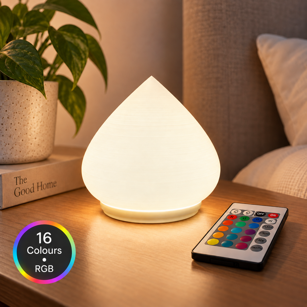 DROVA RGB table lamp glowing in a colourful ambient room