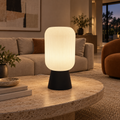 ZENITH large table lamp on a travertine coffee table in a spacious living room