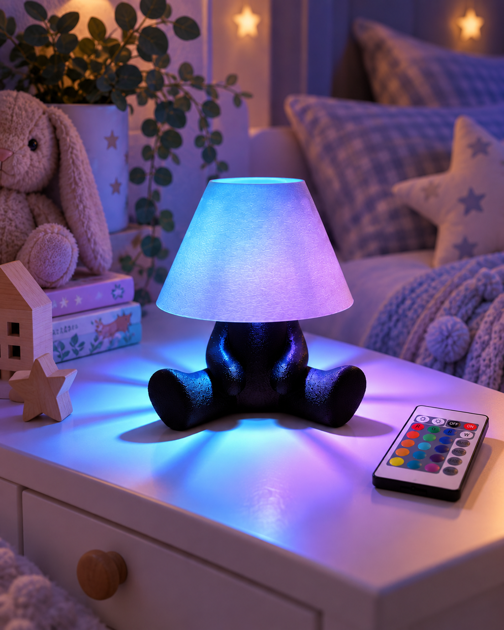 PIXO RGB character table lamp glowing blue and purple in a cosy children's bedroom