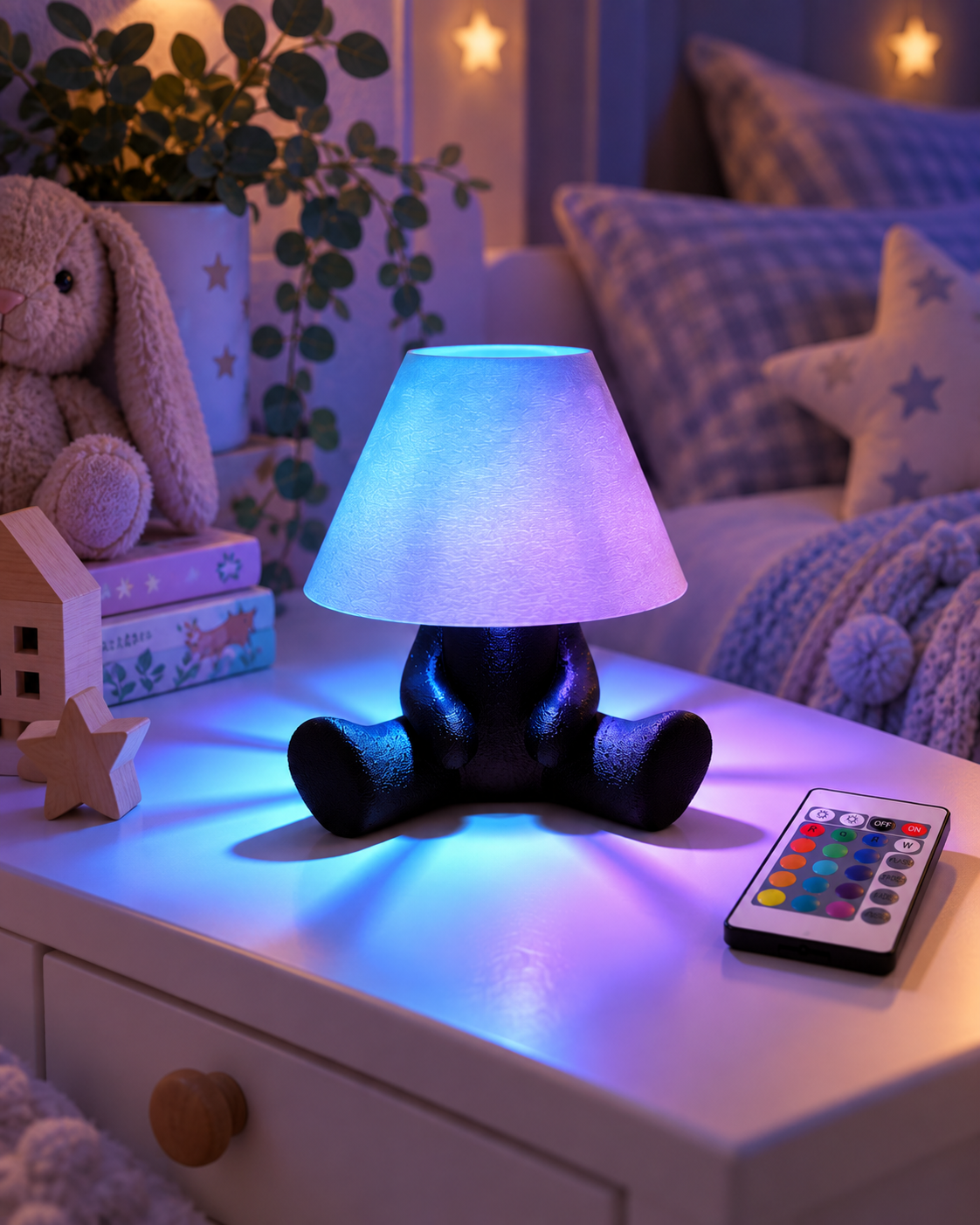 PIXO RGB character table lamp glowing blue and purple in a cosy children's bedroom