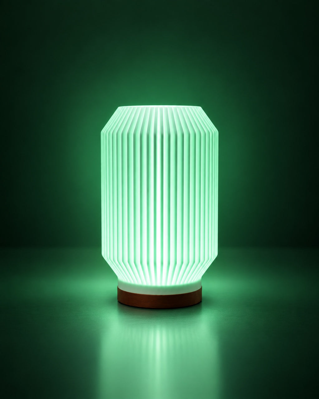 HALCYON RGB lamp glowing green on a dark green studio background