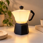 CREMA Table Lamp glowing warmly in a modern interior