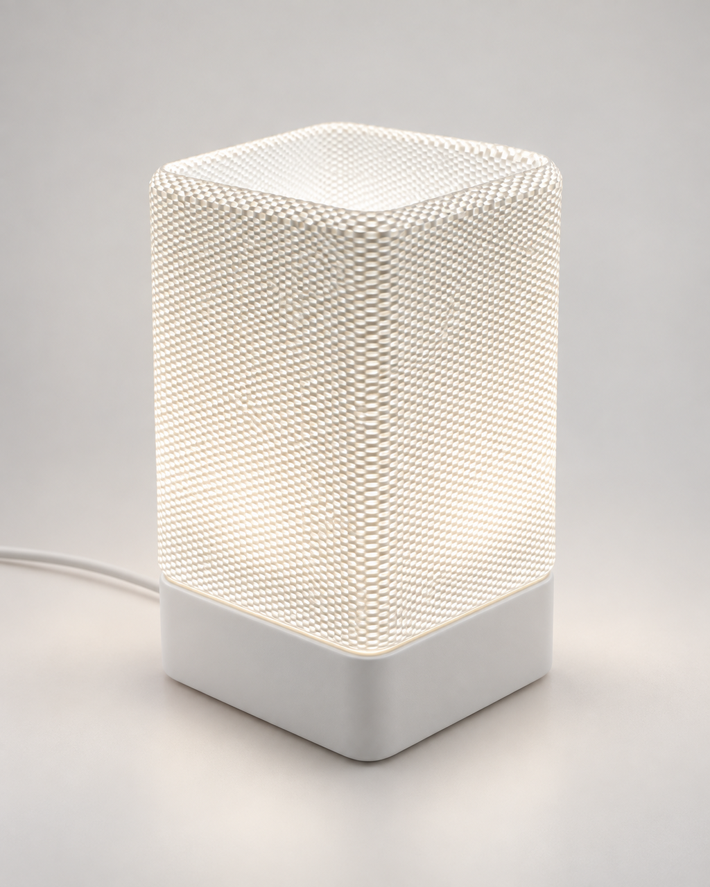 ARQO Table Lamp with white base and sculptural textured diffuser