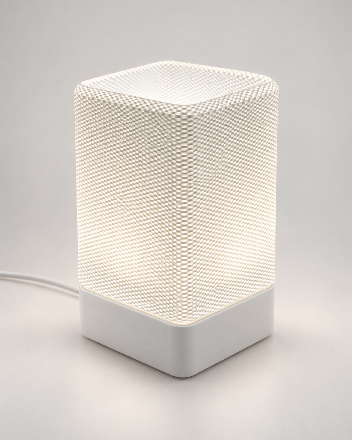 ARQO Table Lamp with white base and sculptural textured diffuser