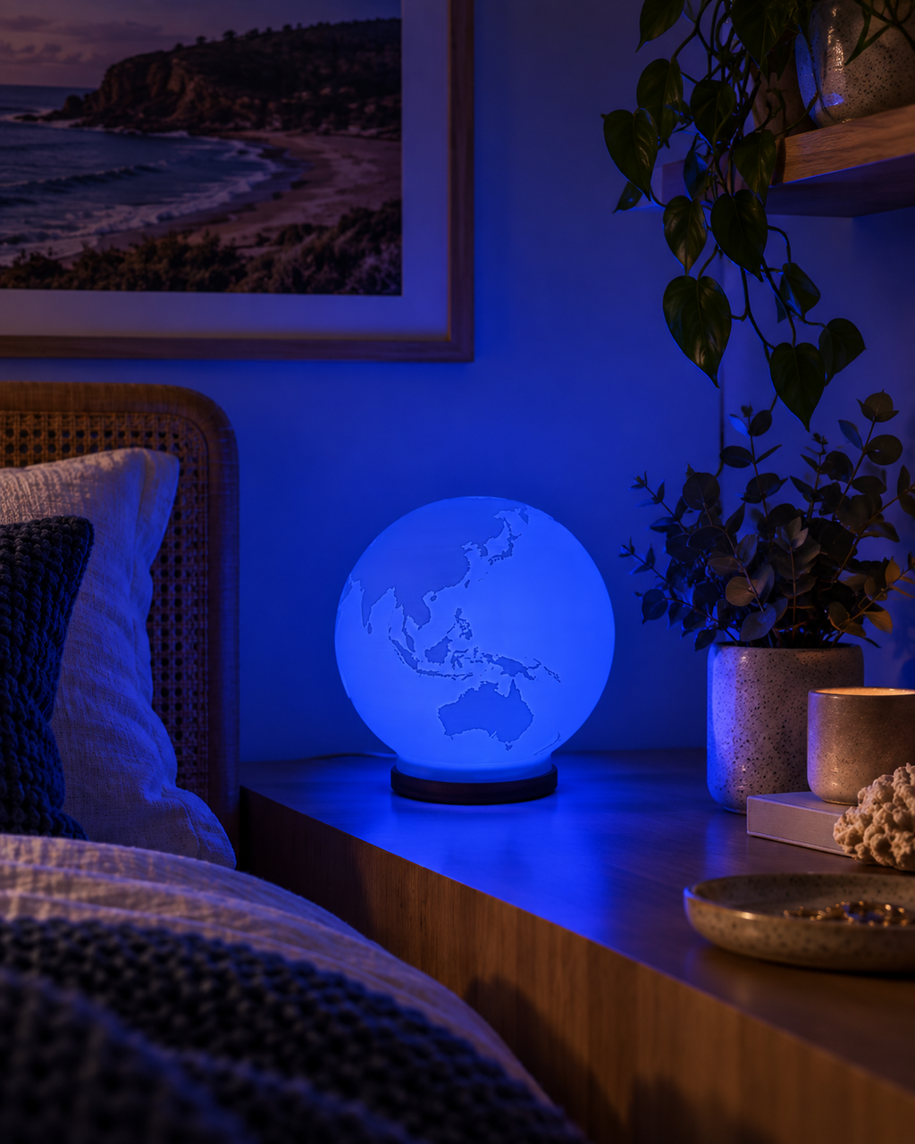 ORBIS RGB globe lamp glowing blue in a modern Australian coastal bedroom